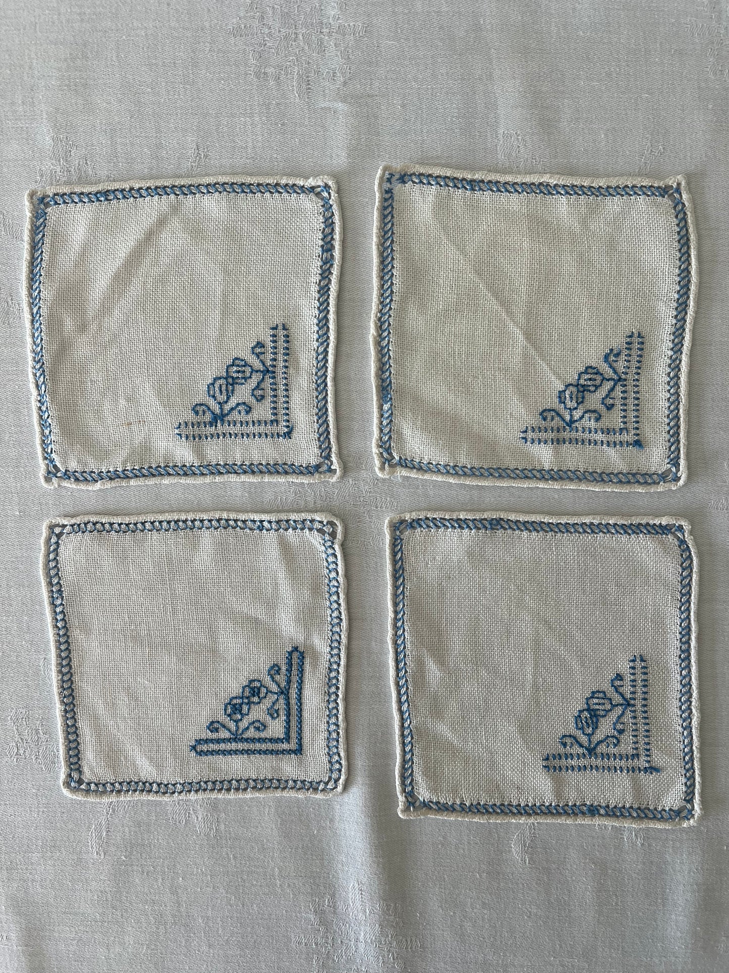 Hand embroided drinks mats