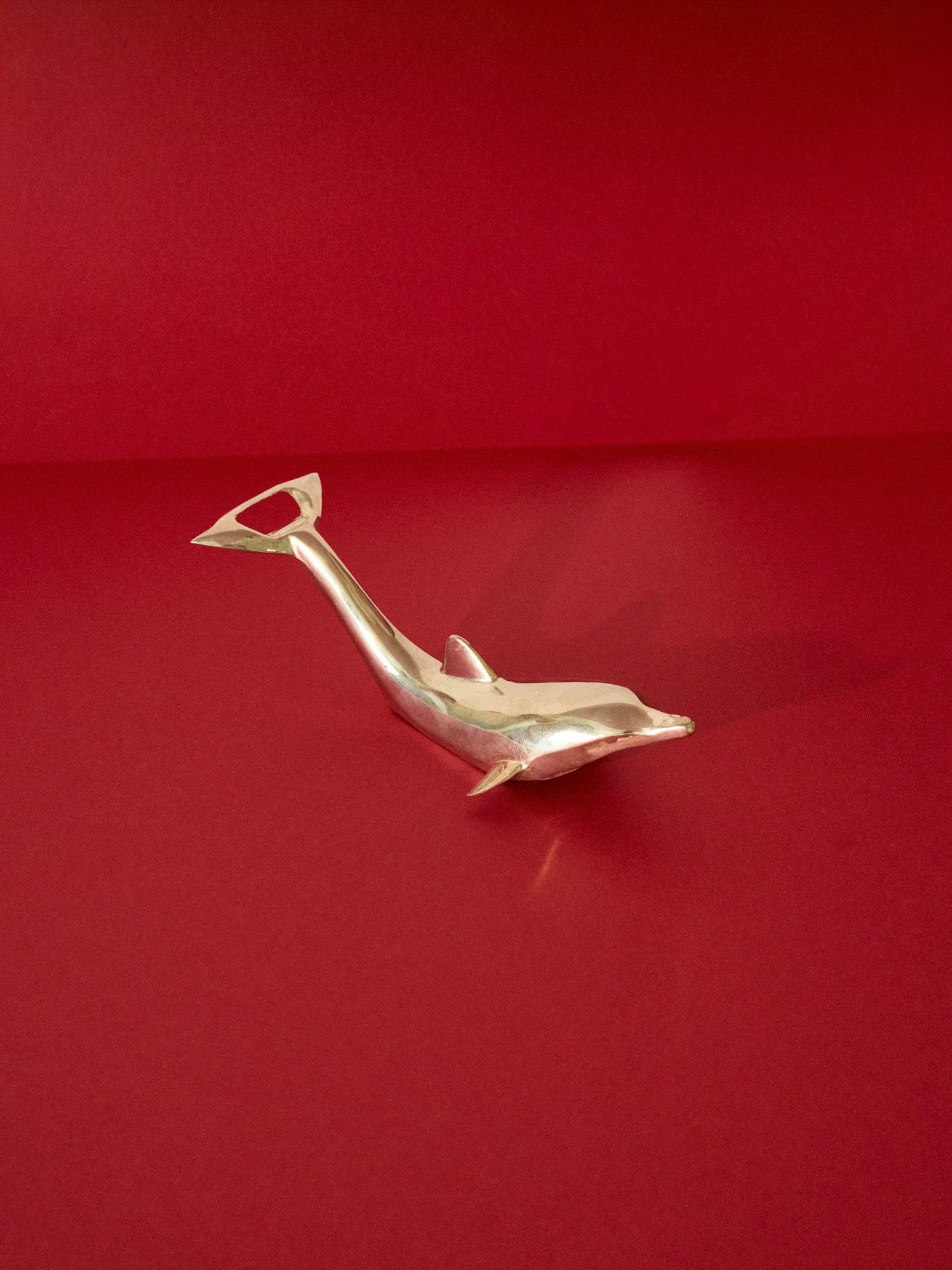 Silver plated dolphin bottle opener