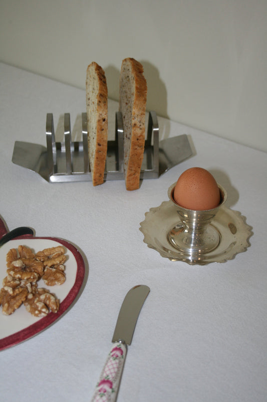 Silver plated egg cup and saucer