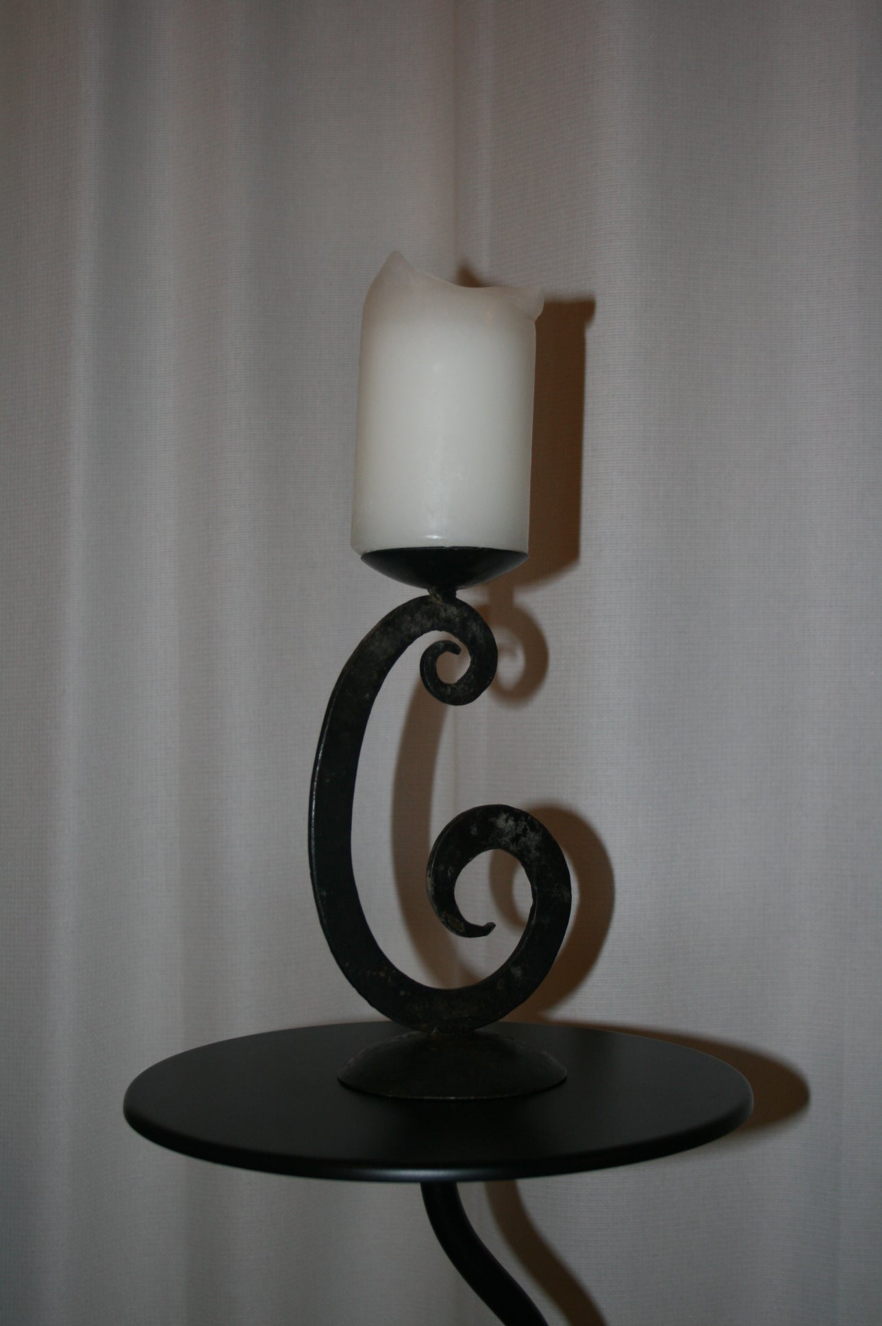 Iron swirl candle holder