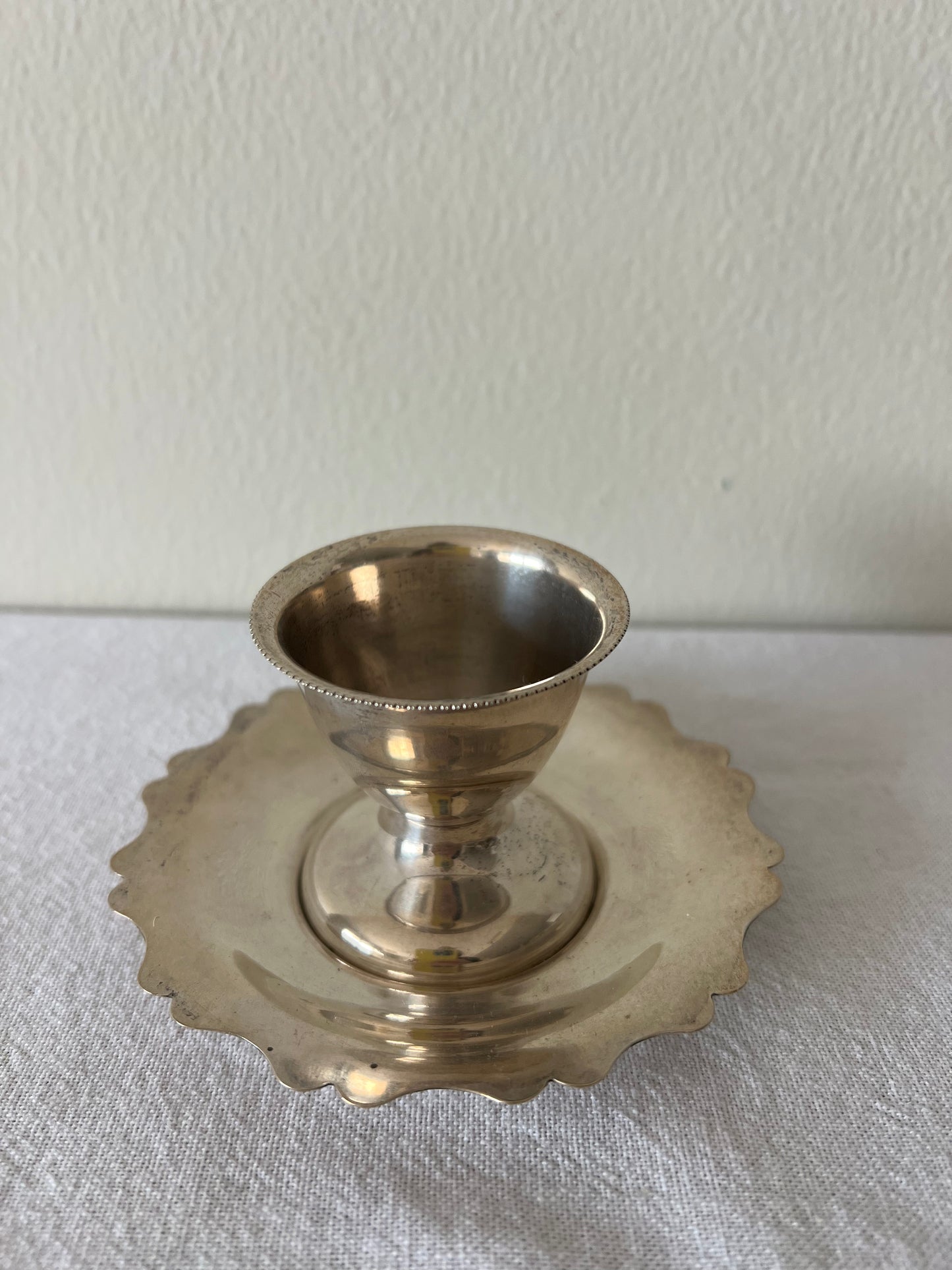 Silver plated egg cup and saucer